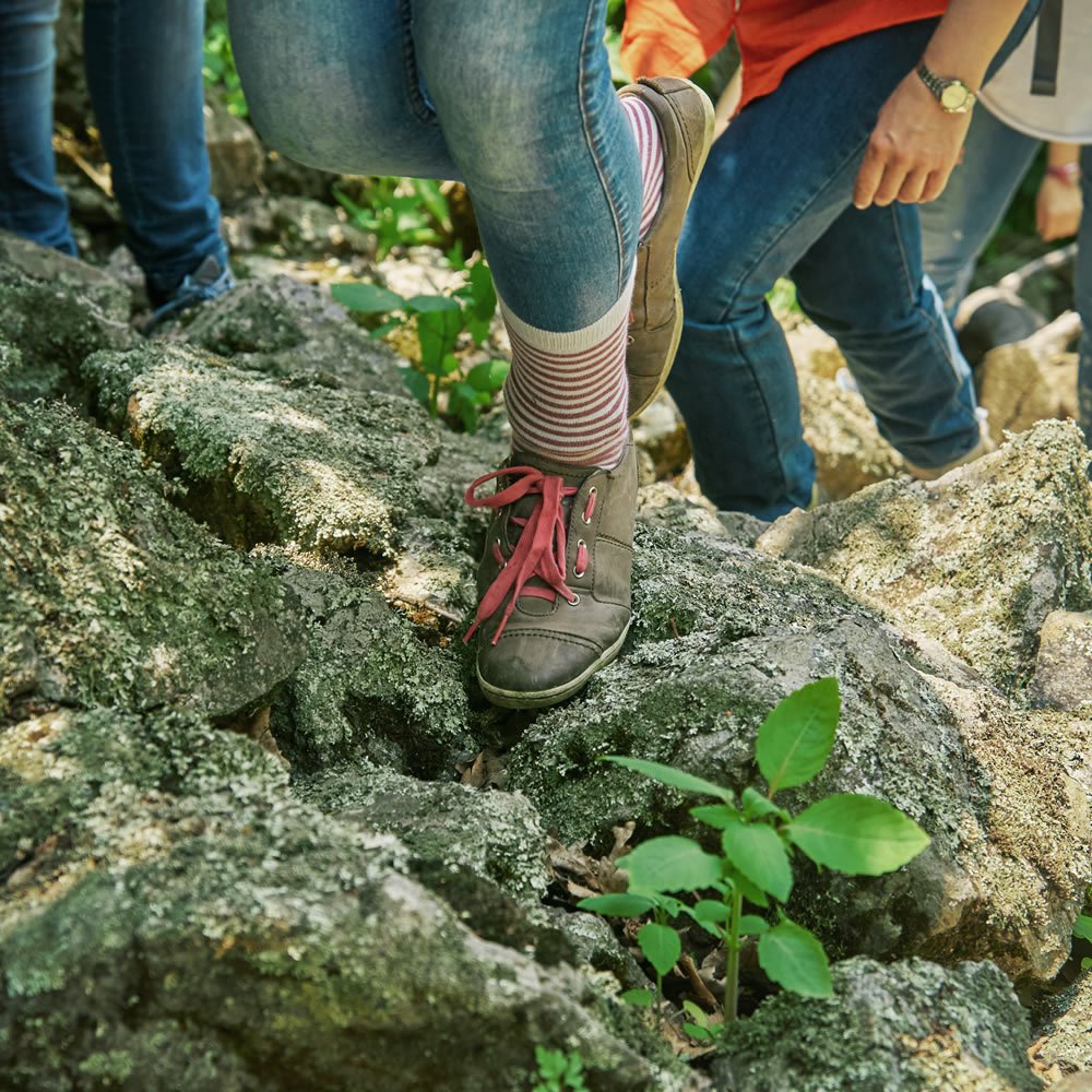 Young people standing together in colourful shoes